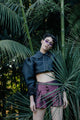 Close up of model wearing the Button Shorts.